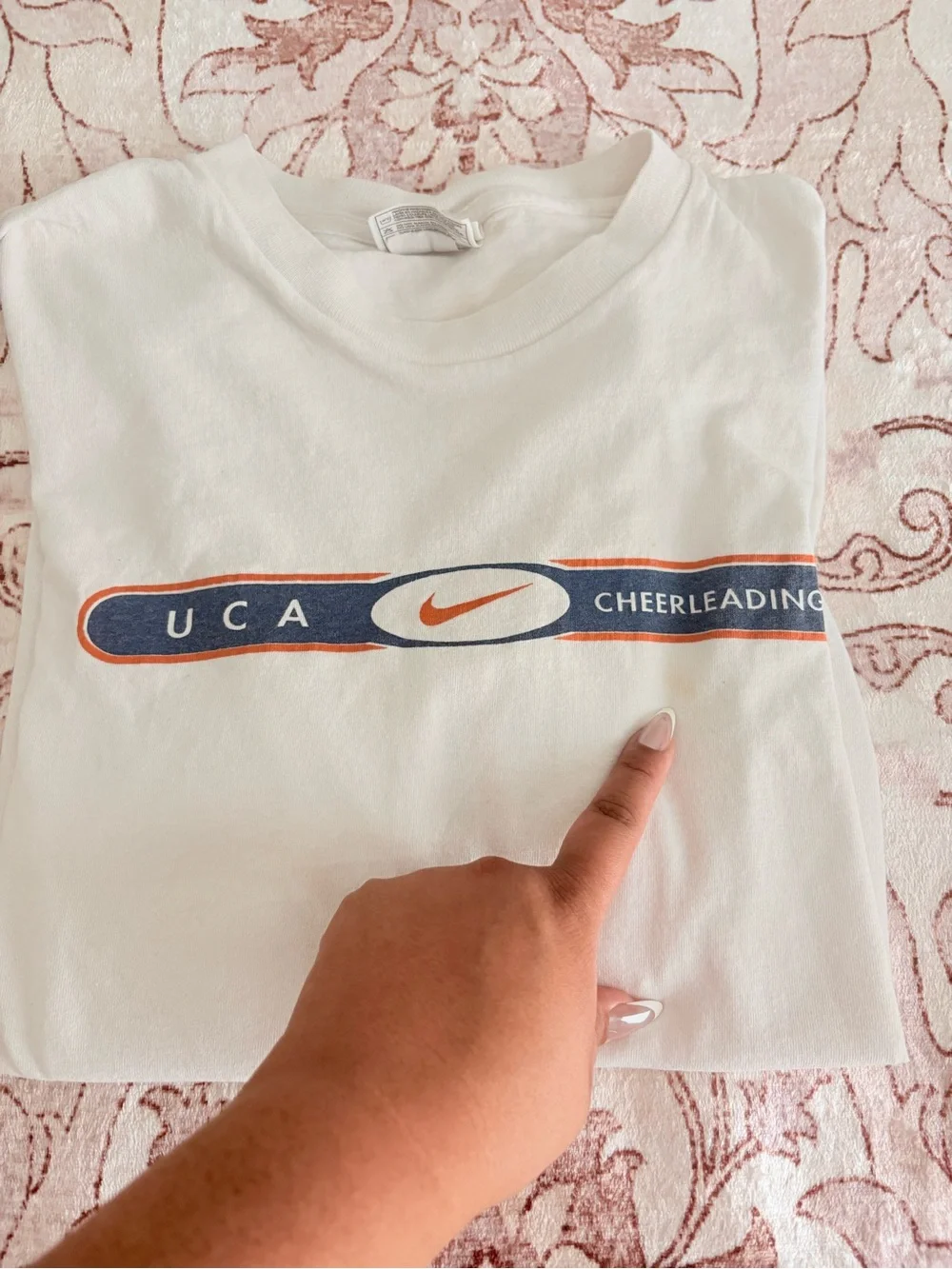 Nike White UCA Cheerleading Short Sleeve Tee with Navy and Orange Logo